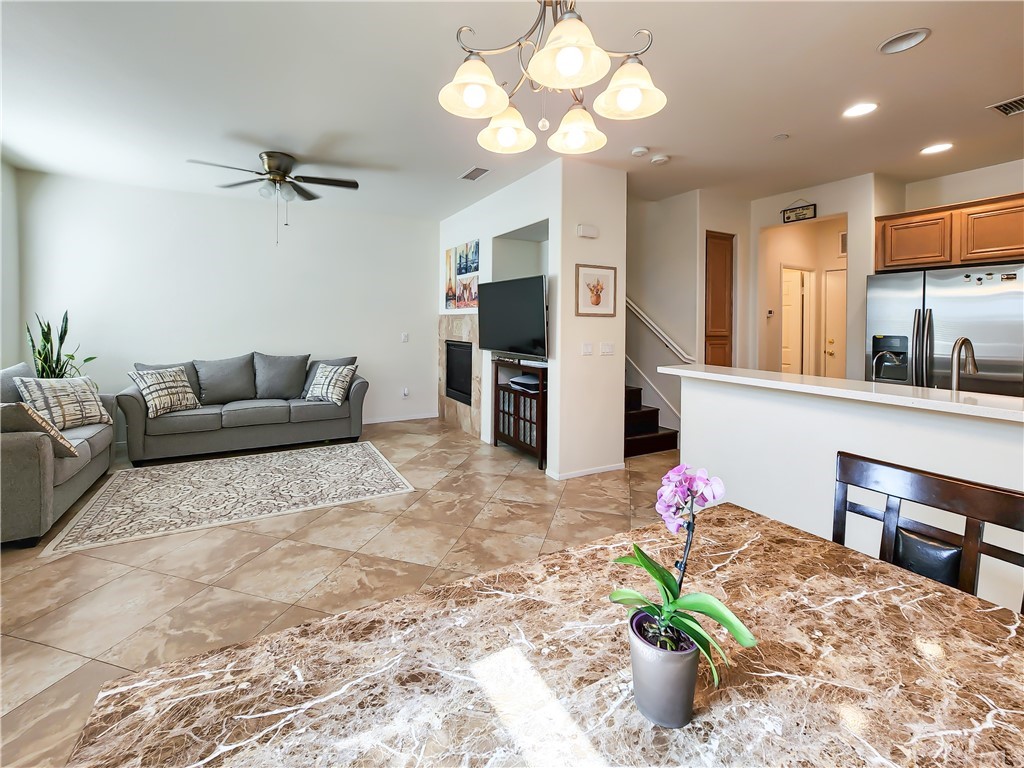 8024 Tulsa Place, Unit 107 Rancho Cucamonga, CA 91730 - Photo 7 of 35 a living room with furniture and a flat screen tv