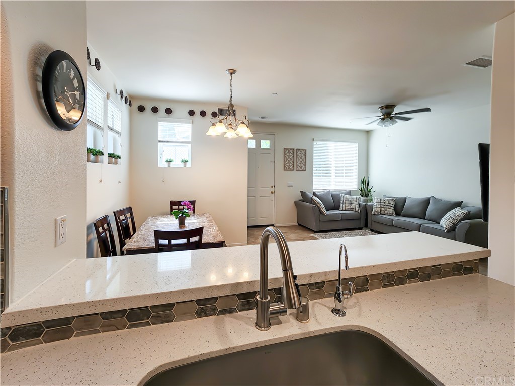 8024 Tulsa Place, Unit 107 Rancho Cucamonga, CA 91730 - Photo 8 of 35 a room with a large mirror and furniture