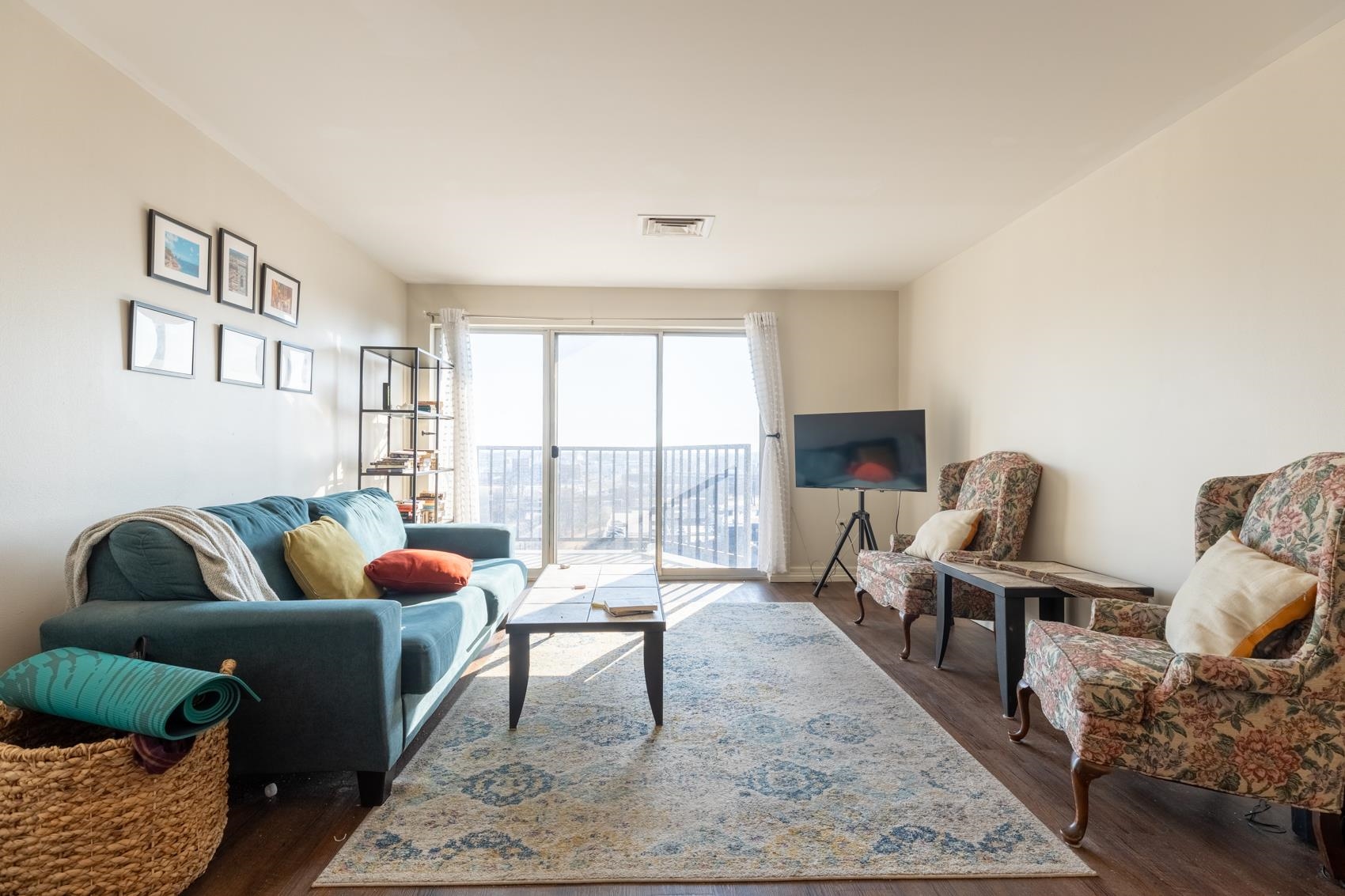 655 Riverside Drive, Unit 1008A Memphis, TN 38103 - Photo 5 of 10 Living room with dark wood finished floors