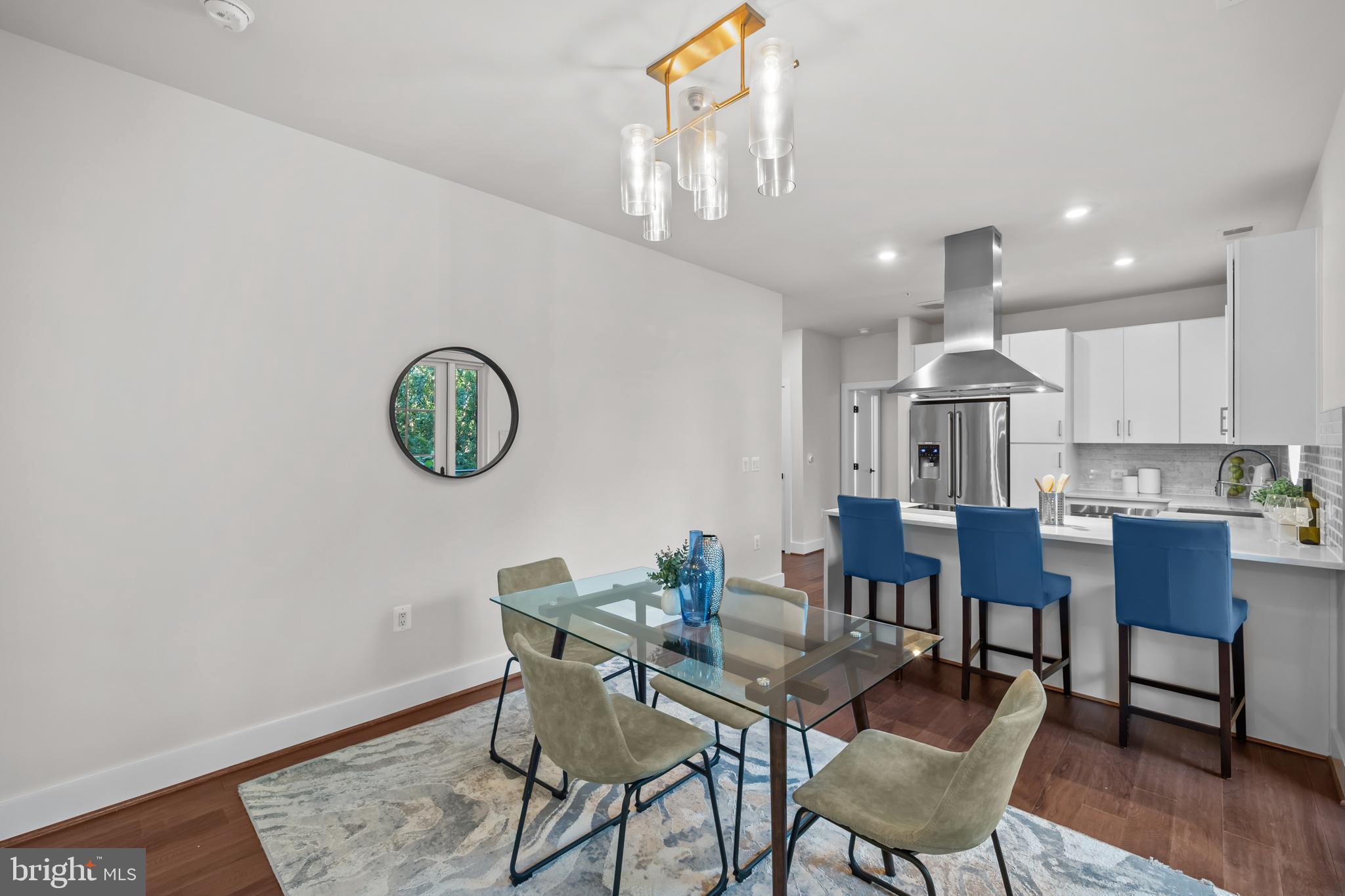 1411 Key Boulevard, Unit 304 Arlington, VA 22209 - Photo 13 of 57 a view of a dining room with furniture