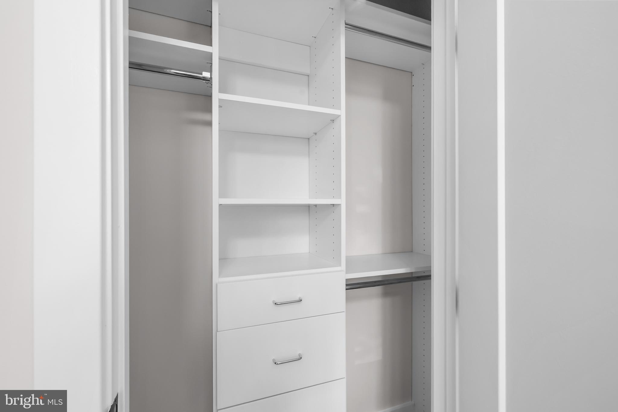 1411 Key Boulevard, Unit 304 Arlington, VA 22209 - Photo 26 of 57 a view of walk in closet with empty racks