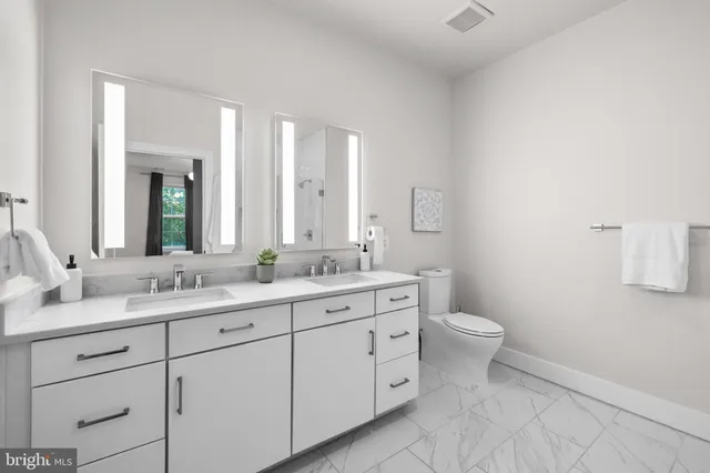 a bathroom with a glass shower door