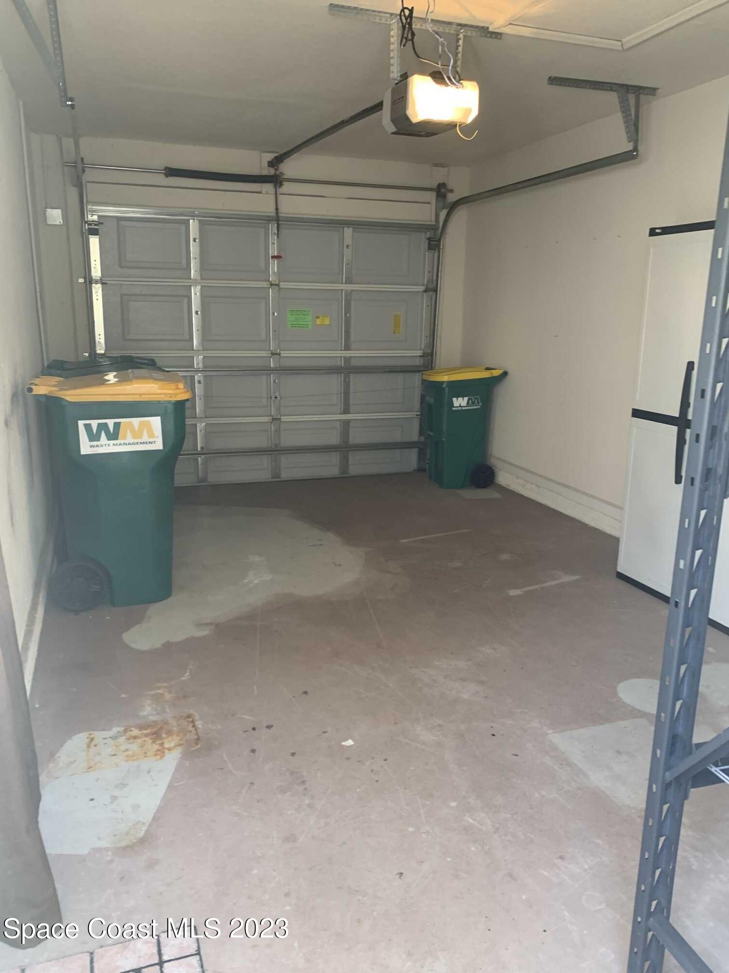 1030 Luminary Circle, Unit 106 Melbourne, FL 32901 - Photo 14 of 14 a view of a garage