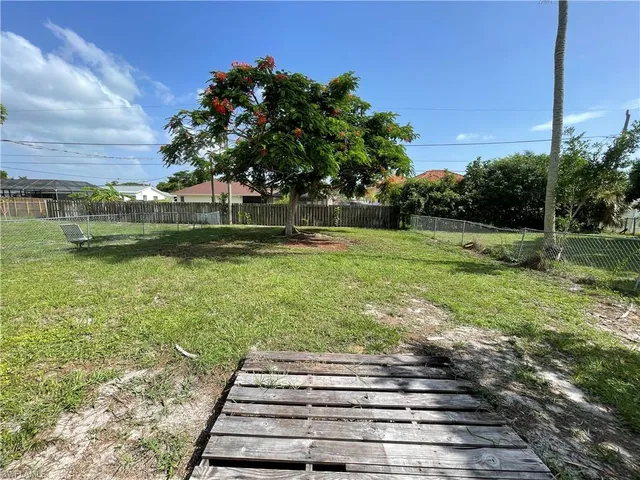 a backyard of a house with lots of green space