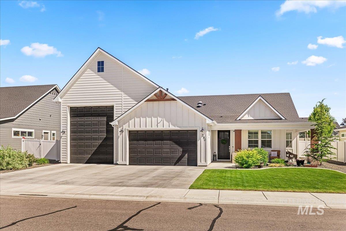 390 Fox Lantern Court Middleton, ID 83644 - Photo 1 of 1 Modern farmhouse style home featuring board and batten siding, a garage, driveway, roof with shingles, and a porch