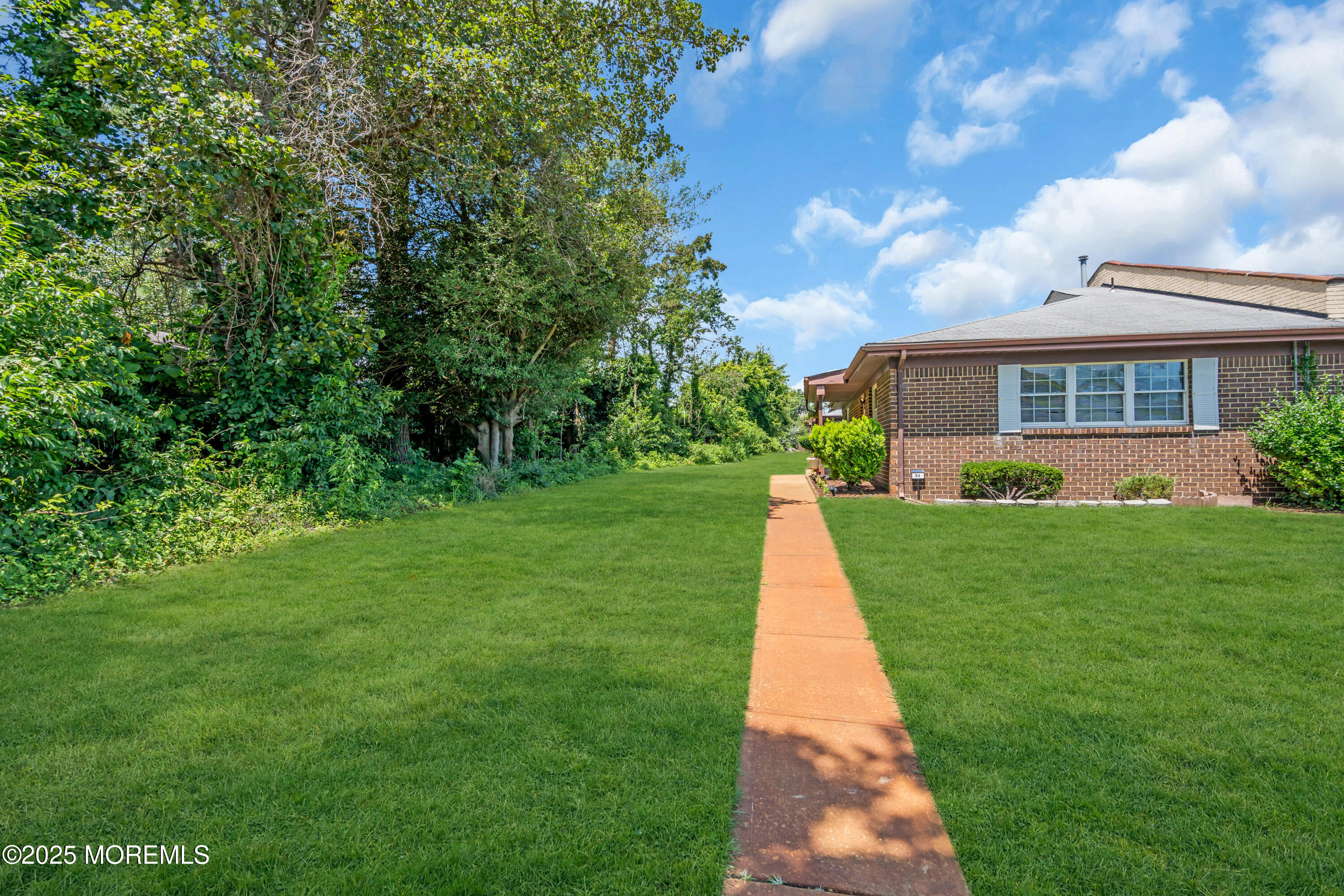 94 Greenwood Loop Road Brick, NJ 08724 - Photo 3 of 22 a view of a house with a yard