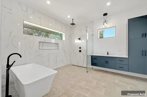 a bathroom with a tub sink and mirror