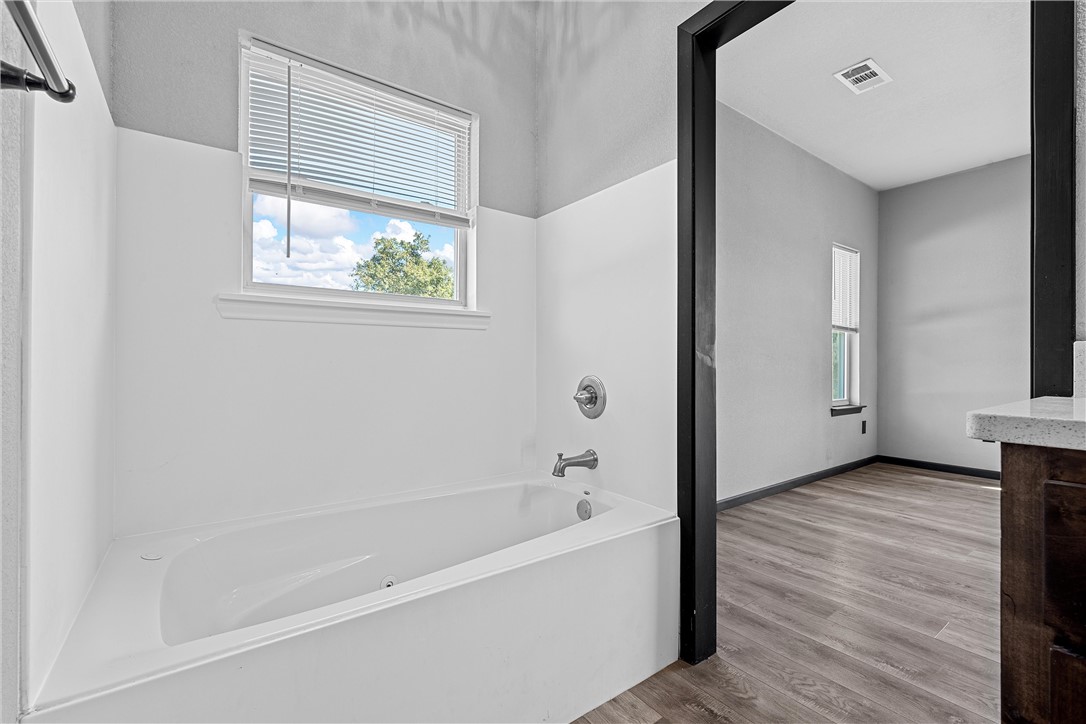 778 Rivercrest Road Valley Mills, TX 76689 - Photo 22 of 66 a bathroom with a bathtub and a window