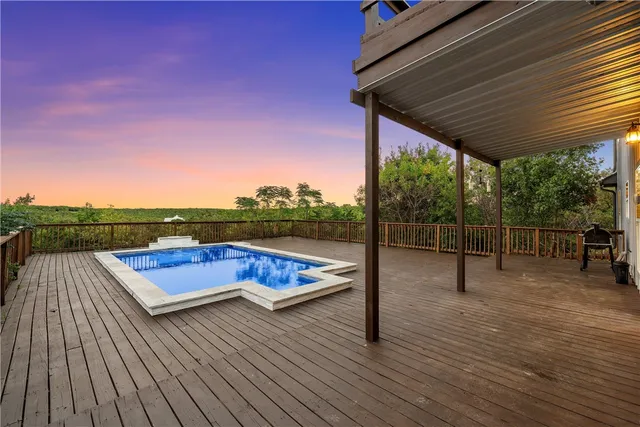 a view of swimming pool with lounge chair