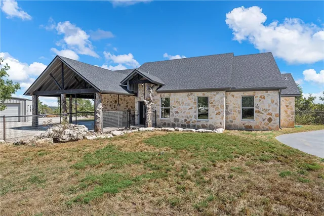 a view of a city with lush green forest