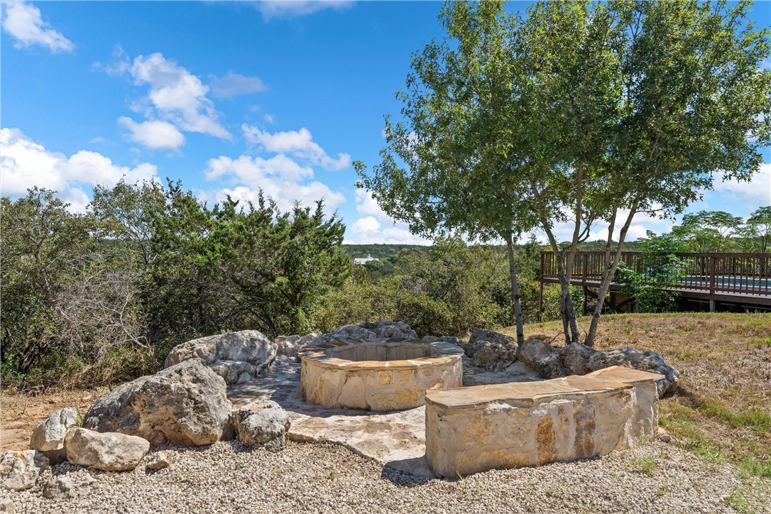 778 Rivercrest Road Valley Mills, TX 76689 - Photo 54 of 66 a view of a backyard with couches and a fire pit