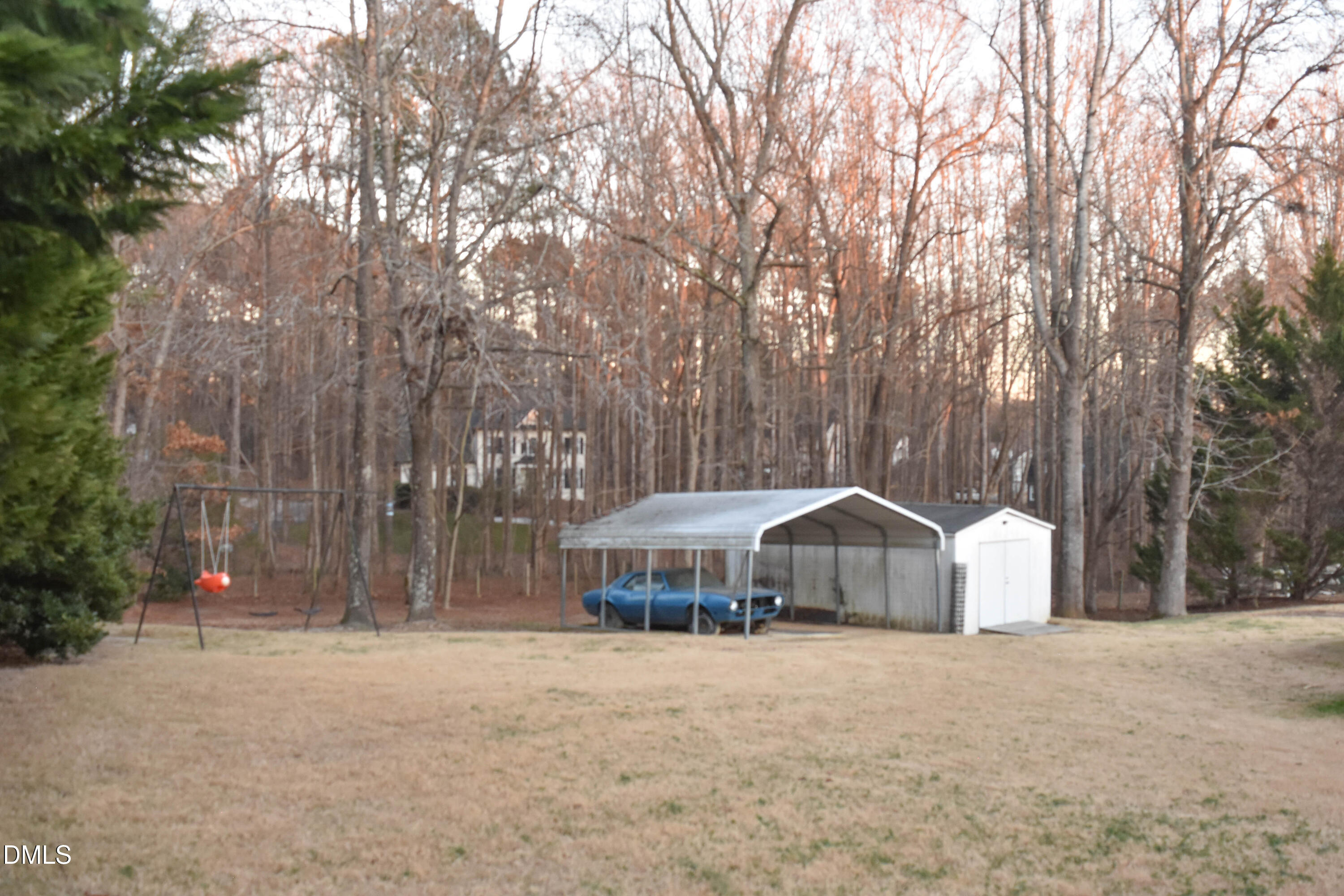 5908 Deep Spring Circle Wake Forest, NC 27587 - Photo 45 of 51 a wooden house with tall trees in front of it