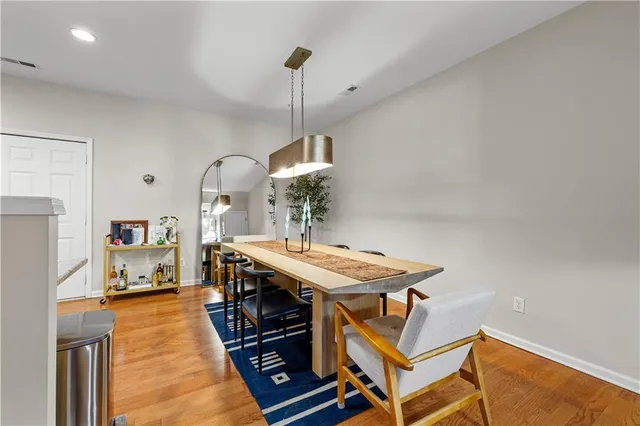 a dining room with a table and chairs