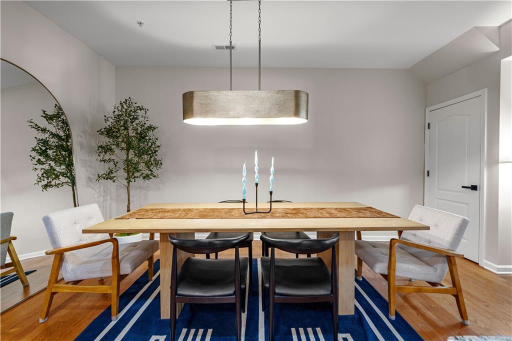100 Portico Place Newnan, GA 30265 - Photo 13 of 51 a view of a dining room with furniture and wooden floor