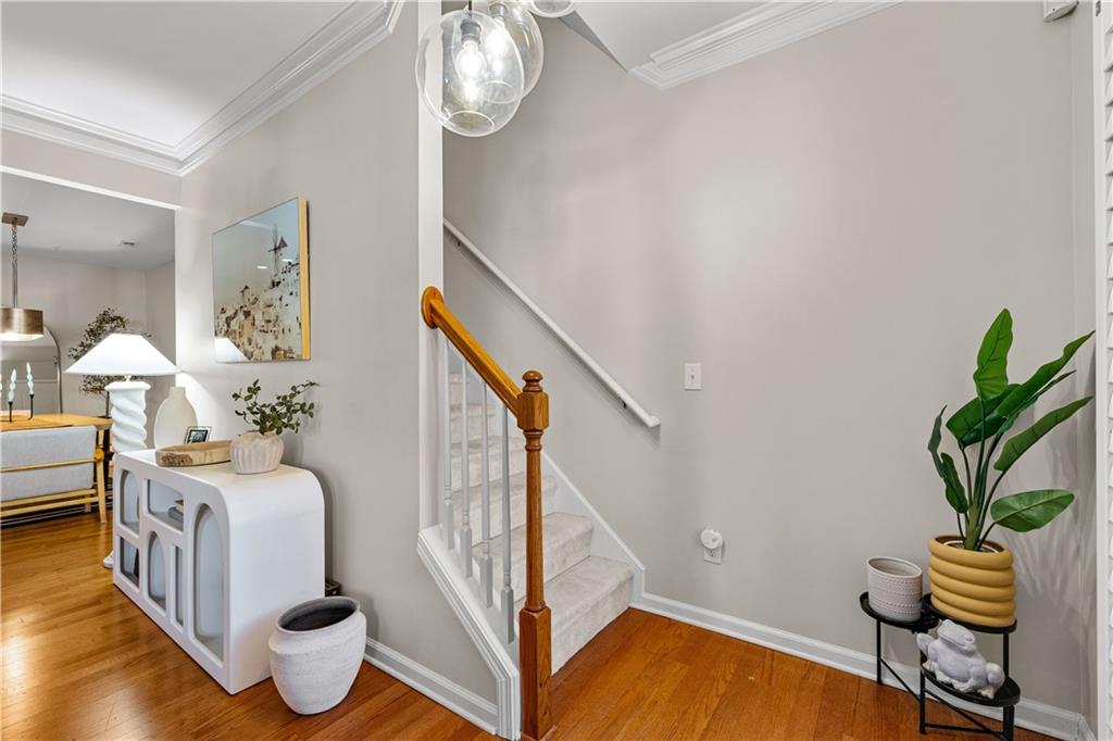 100 Portico Place Newnan, GA 30265 - Photo 17 of 51 a living room with furniture and a potted plant