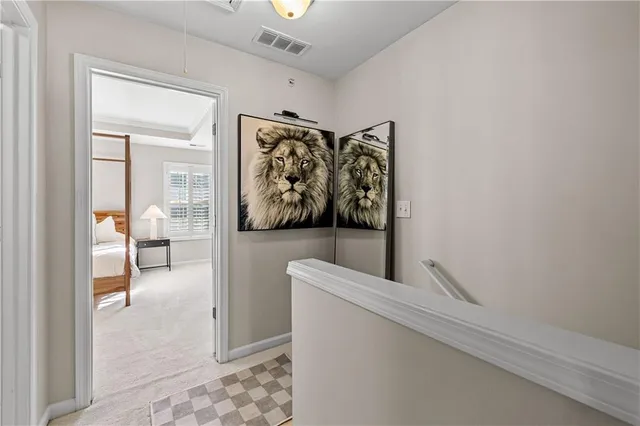 a view of a hallway with white walls and white walls