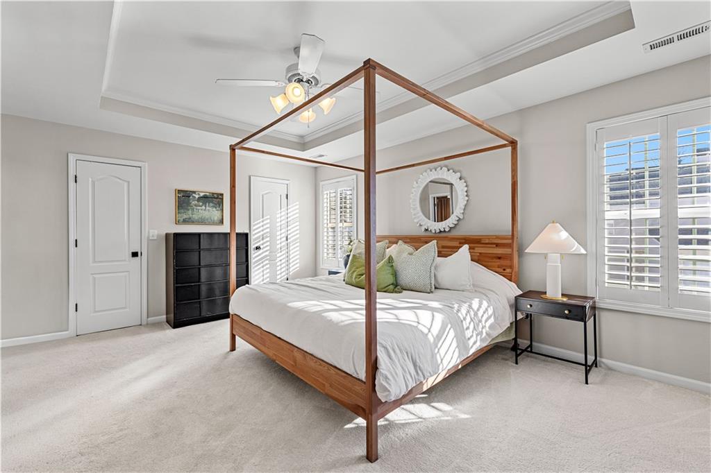 100 Portico Place Newnan, GA 30265 - Photo 19 of 51 a bedroom with a bed bed and a closet