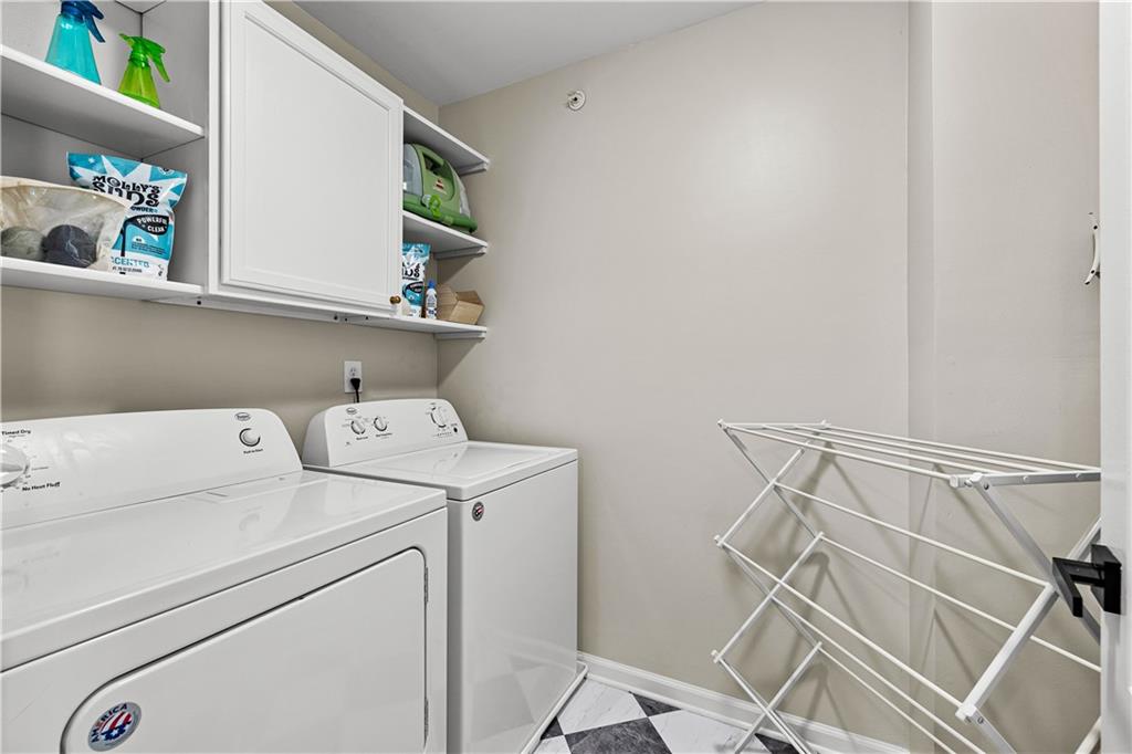 100 Portico Place Newnan, GA 30265 - Photo 26 of 51 a utility room with dryer and washer
