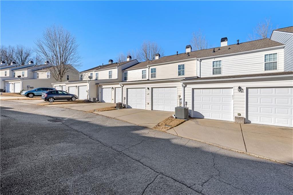 100 Portico Place Newnan, GA 30265 - Photo 32 of 51 a view of a building with outdoor space and parking