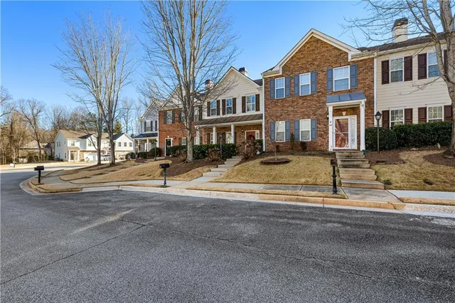 a front view of residential houses with street