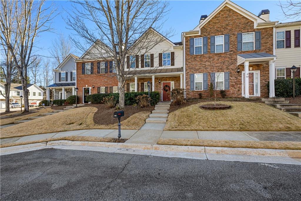 100 Portico Place Newnan, GA 30265 - Photo 36 of 51 a front view of residential houses with street