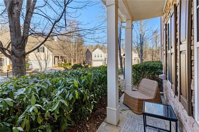 a view of a balcony with chair and table
