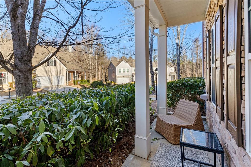 100 Portico Place Newnan, GA 30265 - Photo 4 of 51 a view of a balcony with chair and table