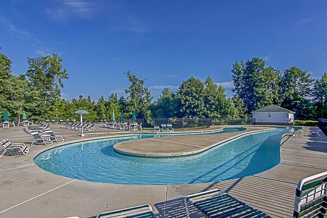 an aerial view of a house a yard and street