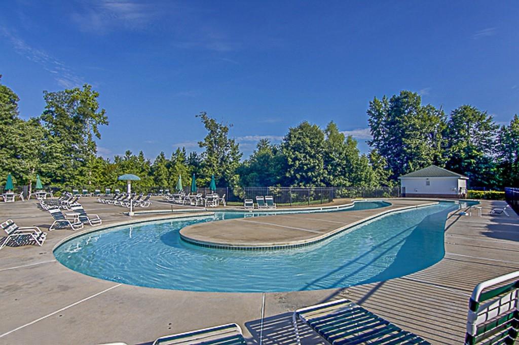 100 Portico Place Newnan, GA 30265 - Photo 48 of 51 a view of a swimming pool with a yard