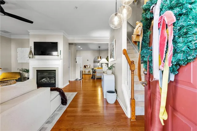 a living room with furniture fireplace and flat screen tv