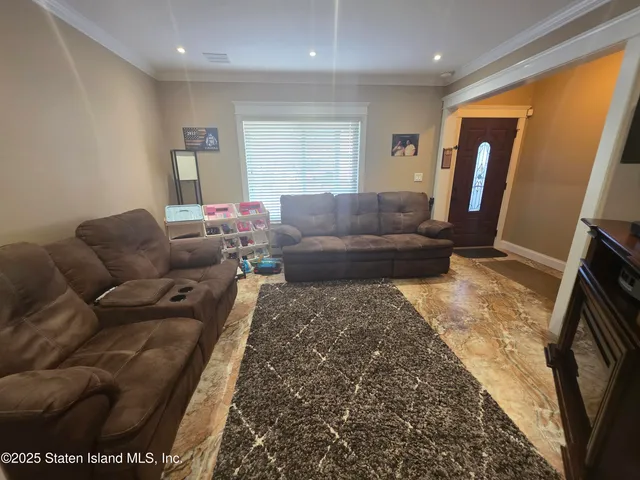 a view of a dining room with furniture wooden floor and chandelier