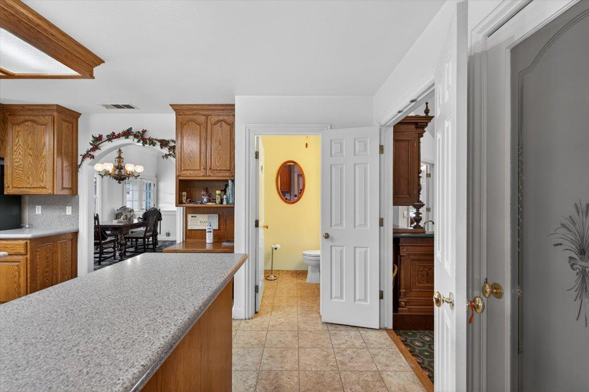 30324 Lone Tree Road Oakdale, CA 95361 - Photo 20 of 74 a kitchen with stainless steel appliances granite countertop a refrigerator and a sink