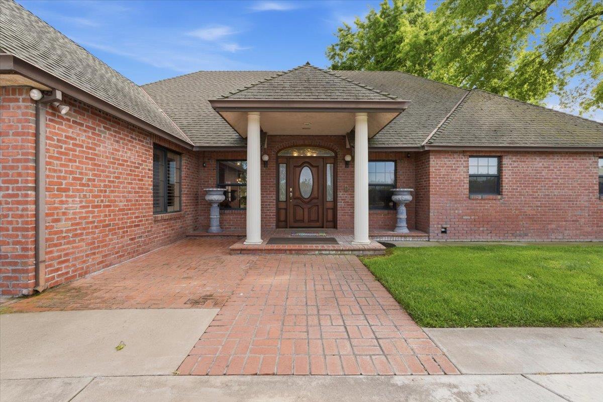 30324 Lone Tree Road Oakdale, CA 95361 - Photo 2 of 74 front view of a house with a yard