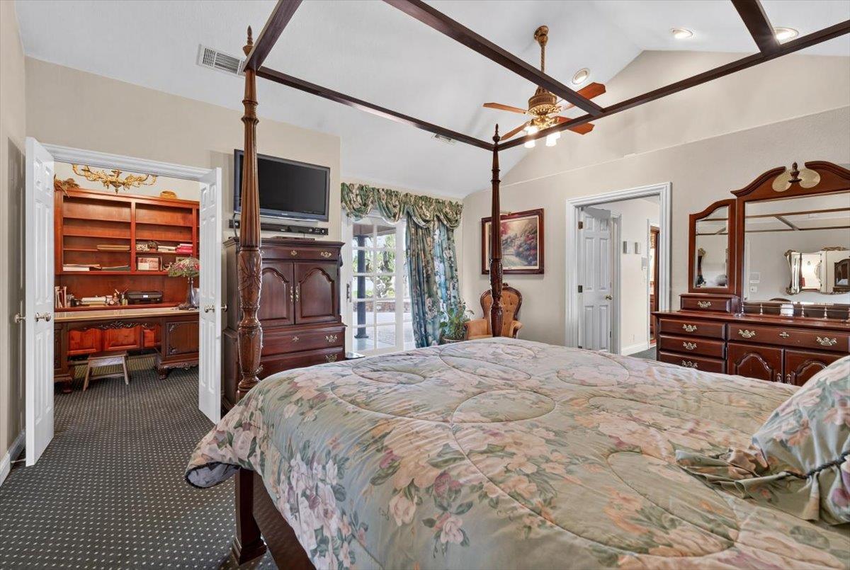 30324 Lone Tree Road Oakdale, CA 95361 - Photo 24 of 74 a bed room with a bed and a television