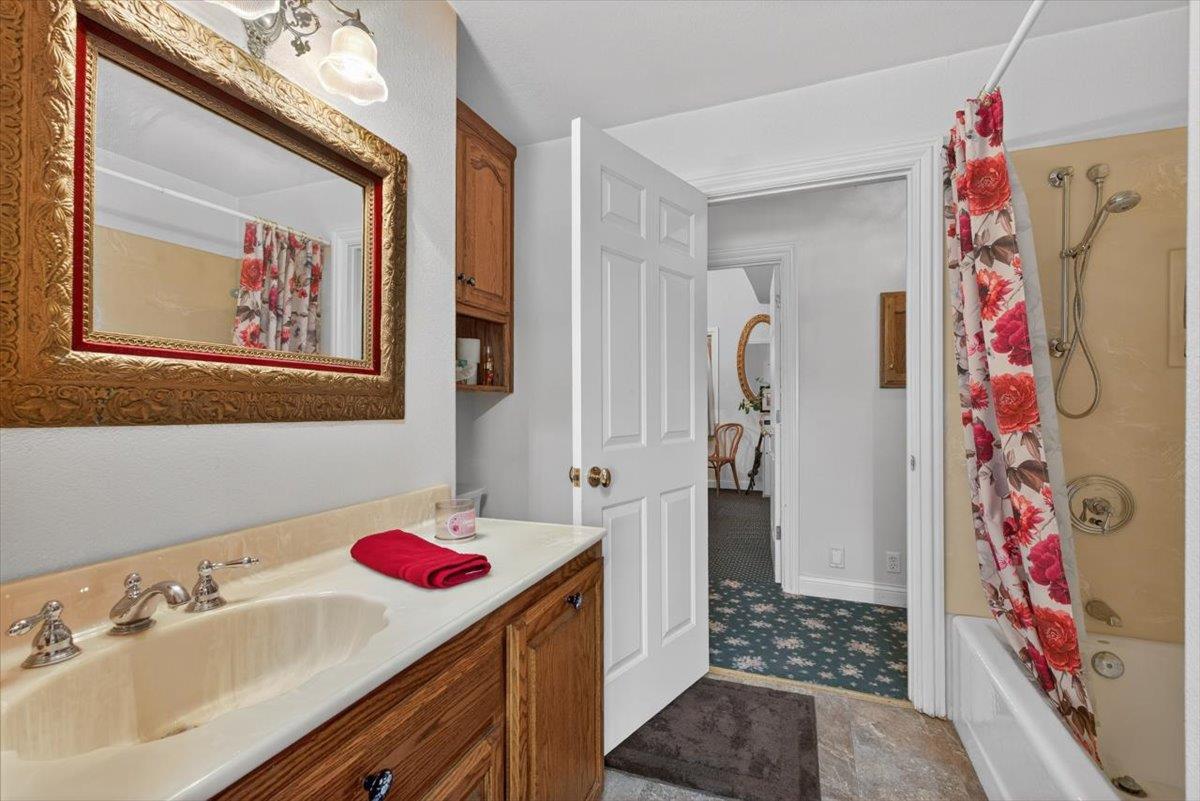 30324 Lone Tree Road Oakdale, CA 95361 - Photo 33 of 74 a bathroom with a sink and a mirror
