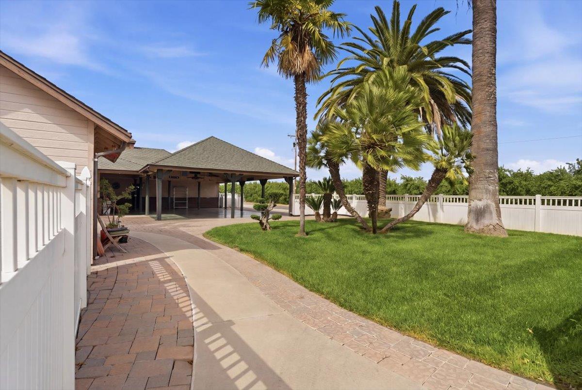 30324 Lone Tree Road Oakdale, CA 95361 - Photo 43 of 74 a front view of a house with a garden and patio