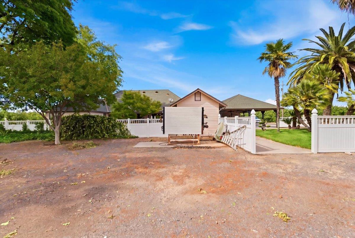 30324 Lone Tree Road Oakdale, CA 95361 - Photo 44 of 74 a view of a house with a yard and garage