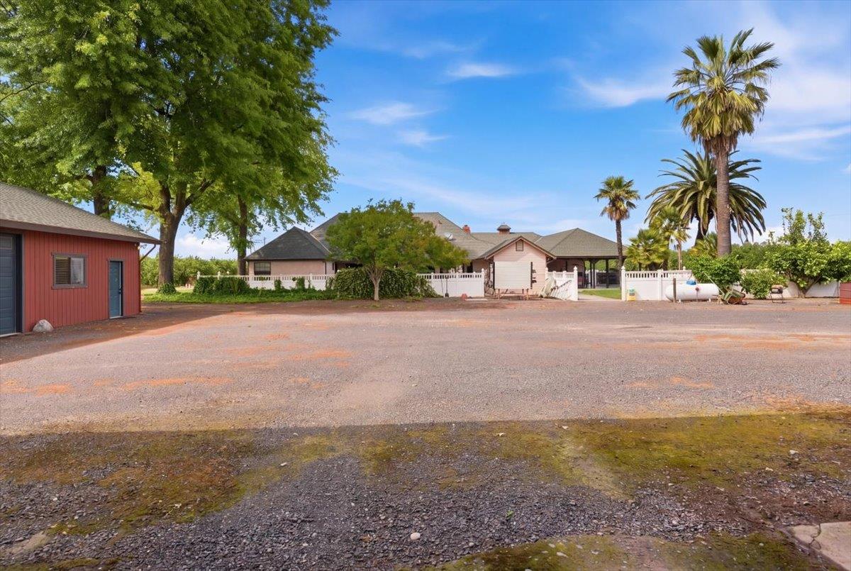 30324 Lone Tree Road Oakdale, CA 95361 - Photo 46 of 74 a view of a house with a yard and garage