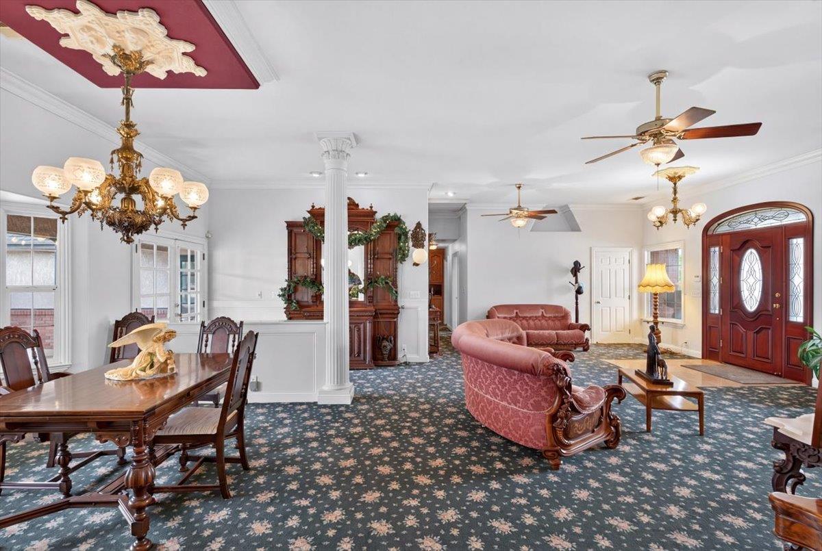 30324 Lone Tree Road Oakdale, CA 95361 - Photo 6 of 74 a living room with furniture and a chandelier