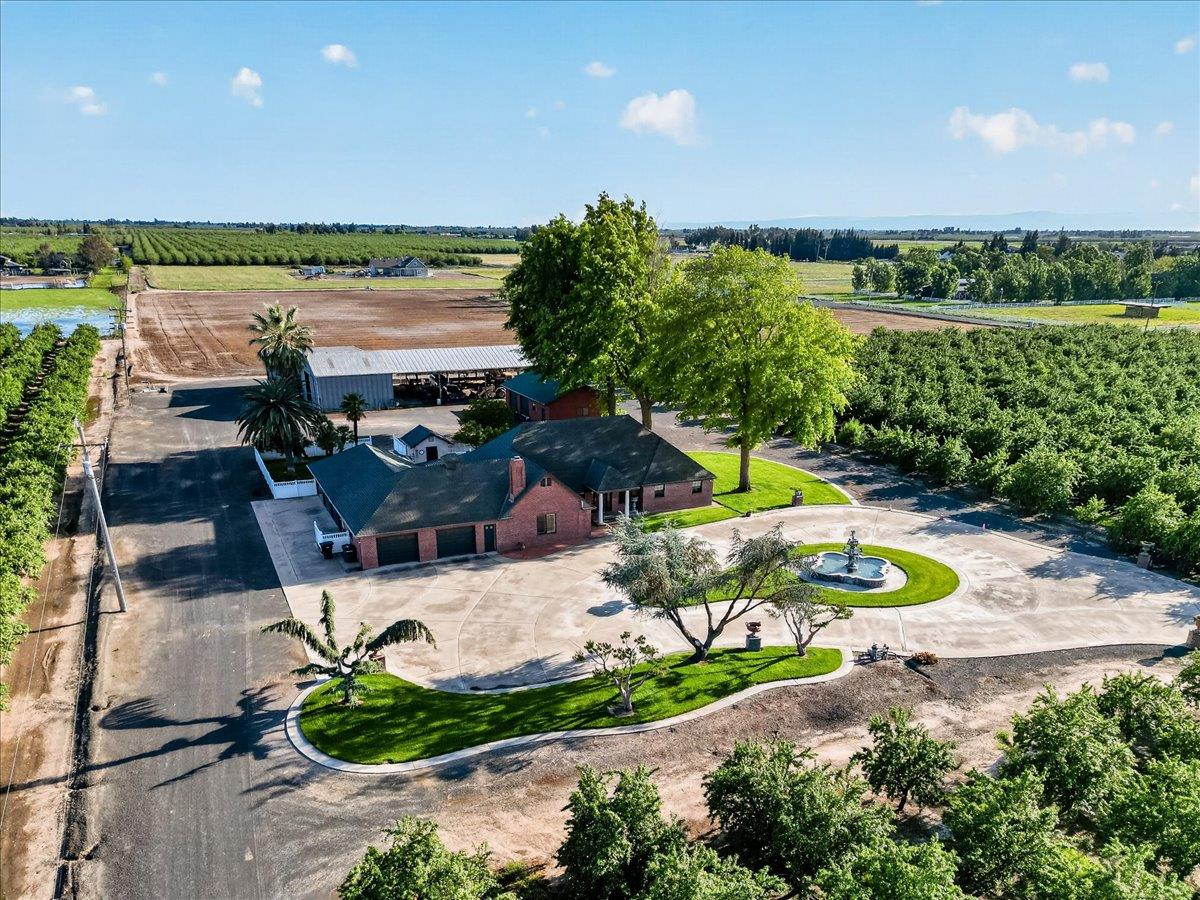 30324 Lone Tree Road Oakdale, CA 95361 - Photo 66 of 74 an aerial view of a house with a garden and lake view