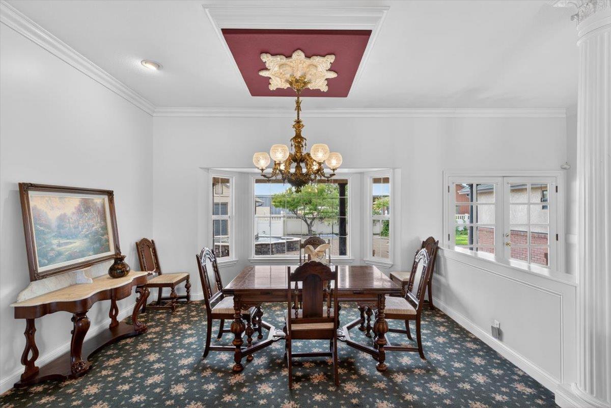 30324 Lone Tree Road Oakdale, CA 95361 - Photo 10 of 74 a view of a dining room with furniture a chandelier and a window