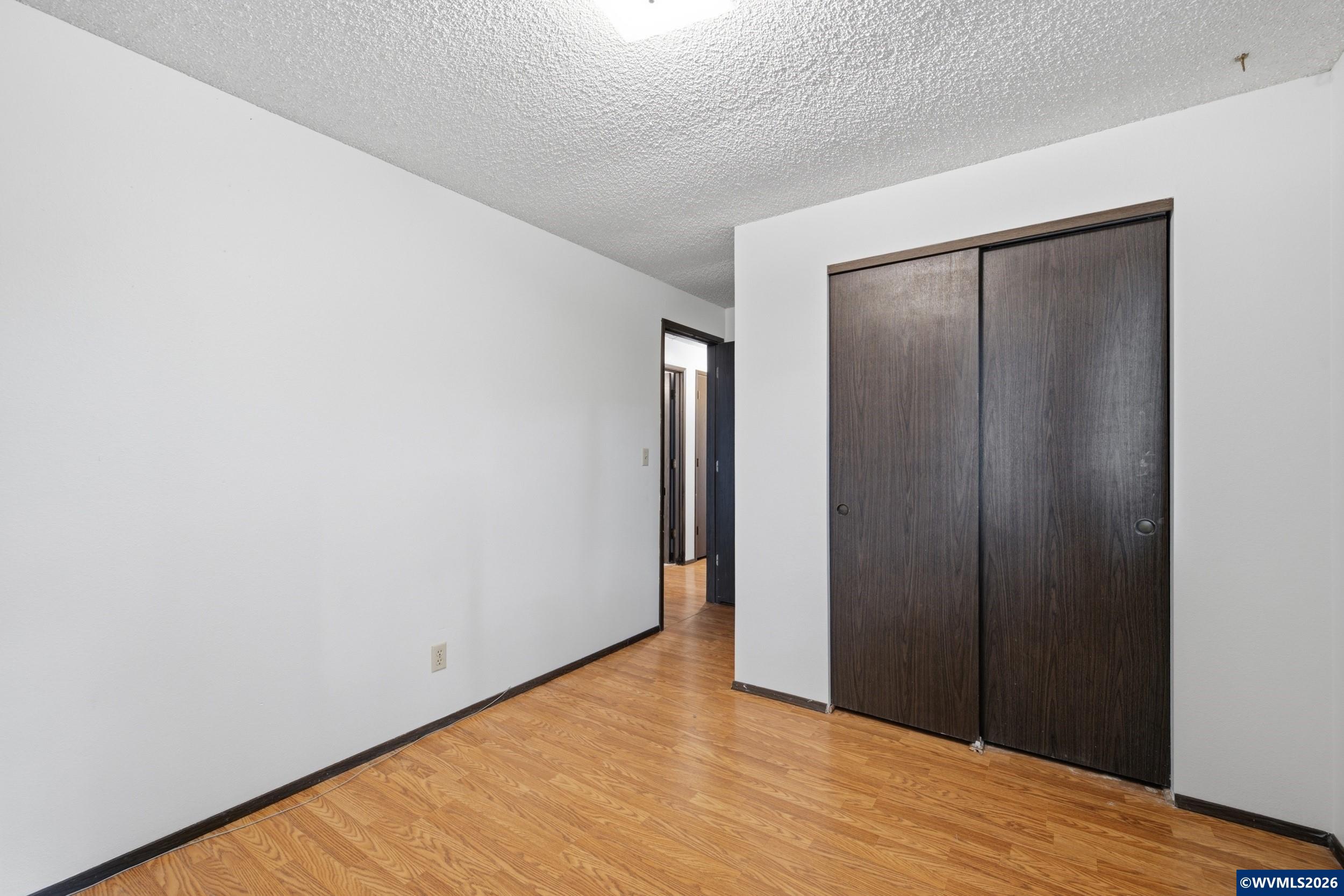 1213 Hemlock Loop Independence, OR 97351 - Photo 15 of 28 a view of hallway with wooden floor