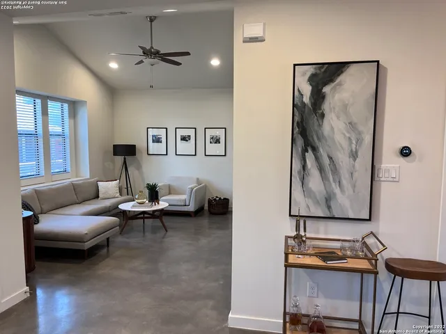 a living room with furniture and a window