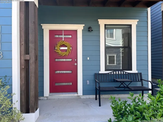 a view of a bench in back of a door