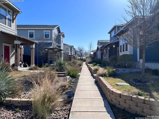 a view of a pathway with a house in the background