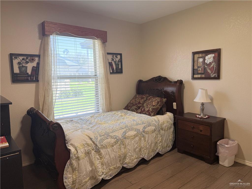 807 East 21st Street, Unit 8 Mission, TX 78572 - Photo 13 of 15 a bedroom with a bed and a window