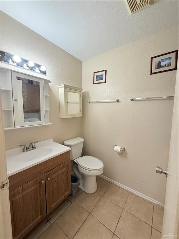 807 East 21st Street, Unit 8 Mission, TX 78572 - Photo 14 of 15 a bathroom with a toilet sink and mirror