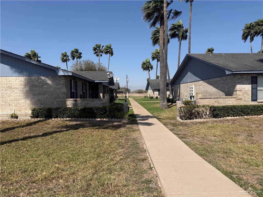 807 East 21st Street, Unit 8 Mission, TX 78572 - Photo 2 of 15 a view of a house with a yard