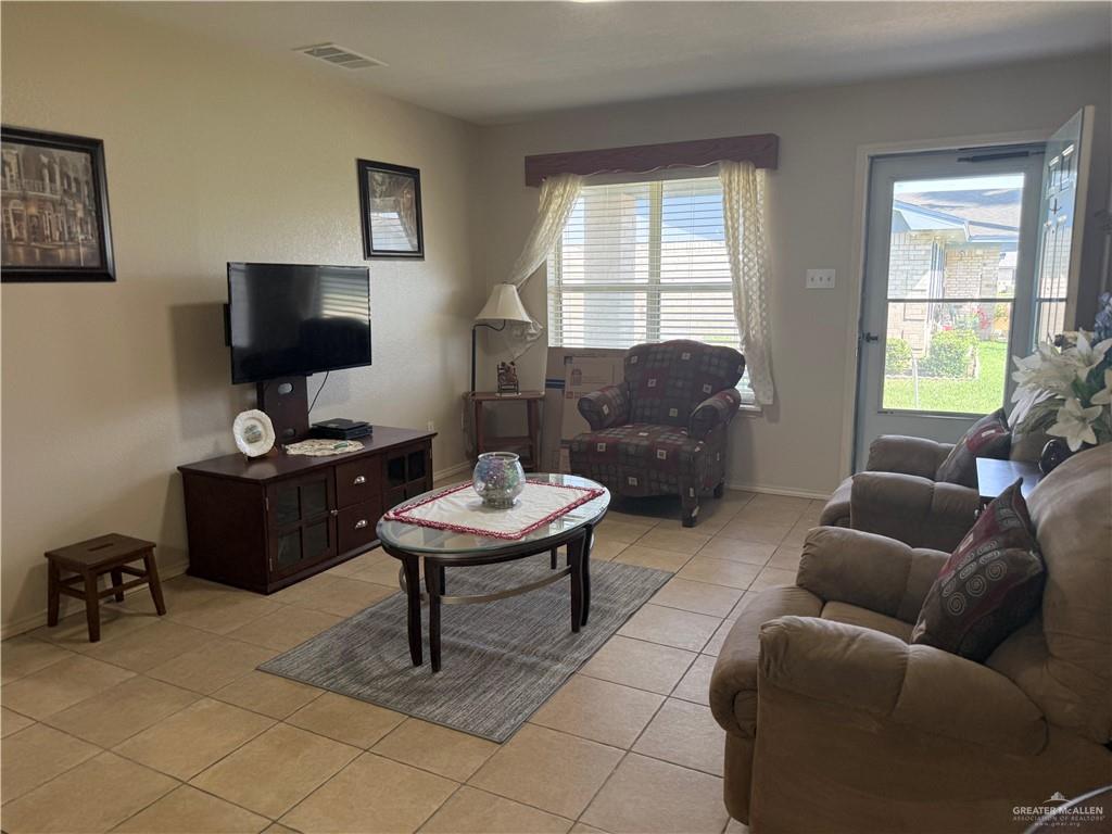 807 East 21st Street, Unit 8 Mission, TX 78572 - Photo 3 of 15 a living room with furniture and a window