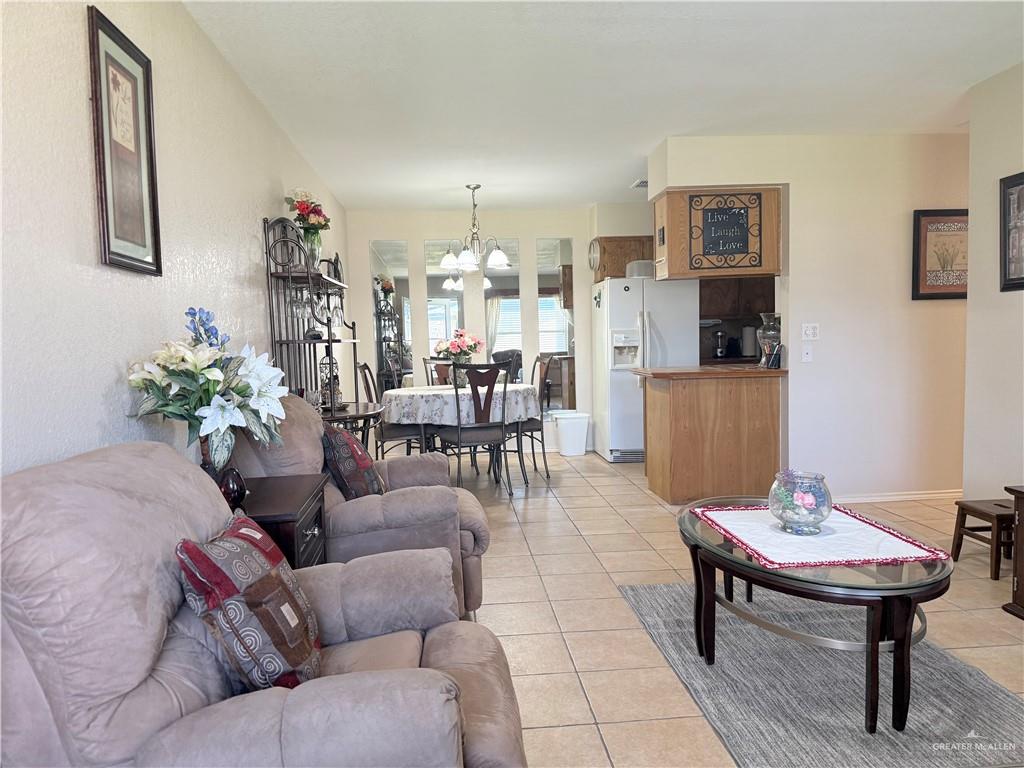 807 East 21st Street, Unit 8 Mission, TX 78572 - Photo 5 of 15 a living room with furniture and a table